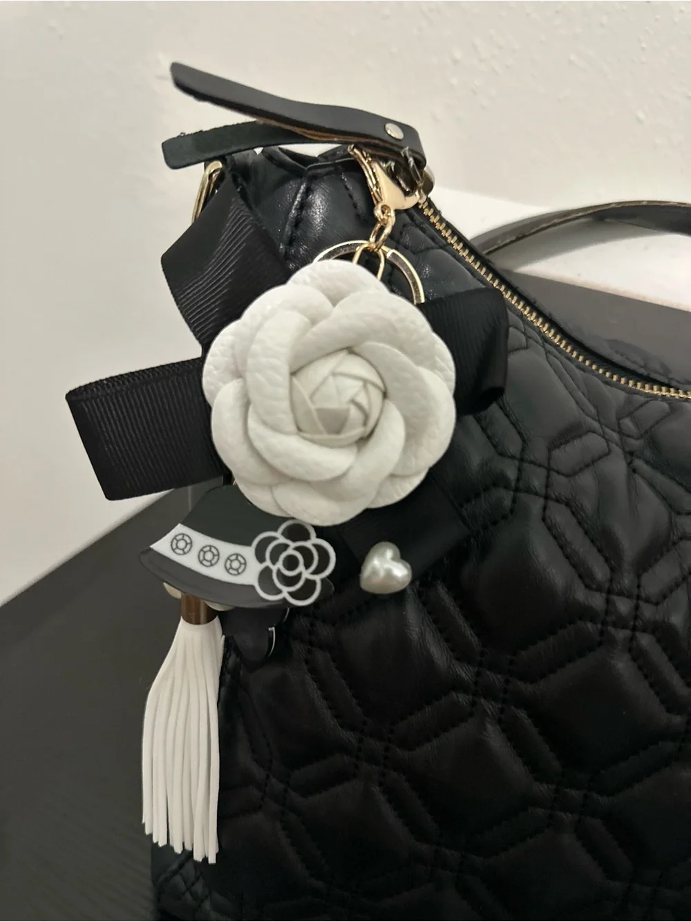 kate spade Astor Court Aurelia Quilted Black Shoulder Bag with charm and pillow.